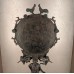 Argive bronze mirror with decorative figures.